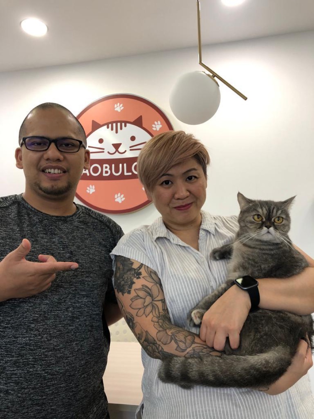 Guests with their cat at Maobulous Cat Boutique Hotel & Spa