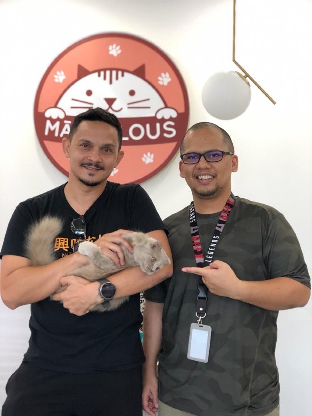 Guest with their cat at Maobulous Cat Boutique Hotel & Spa